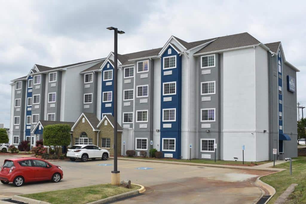 The Microtel in Conway, Arkansas is a blue and gray four story building.