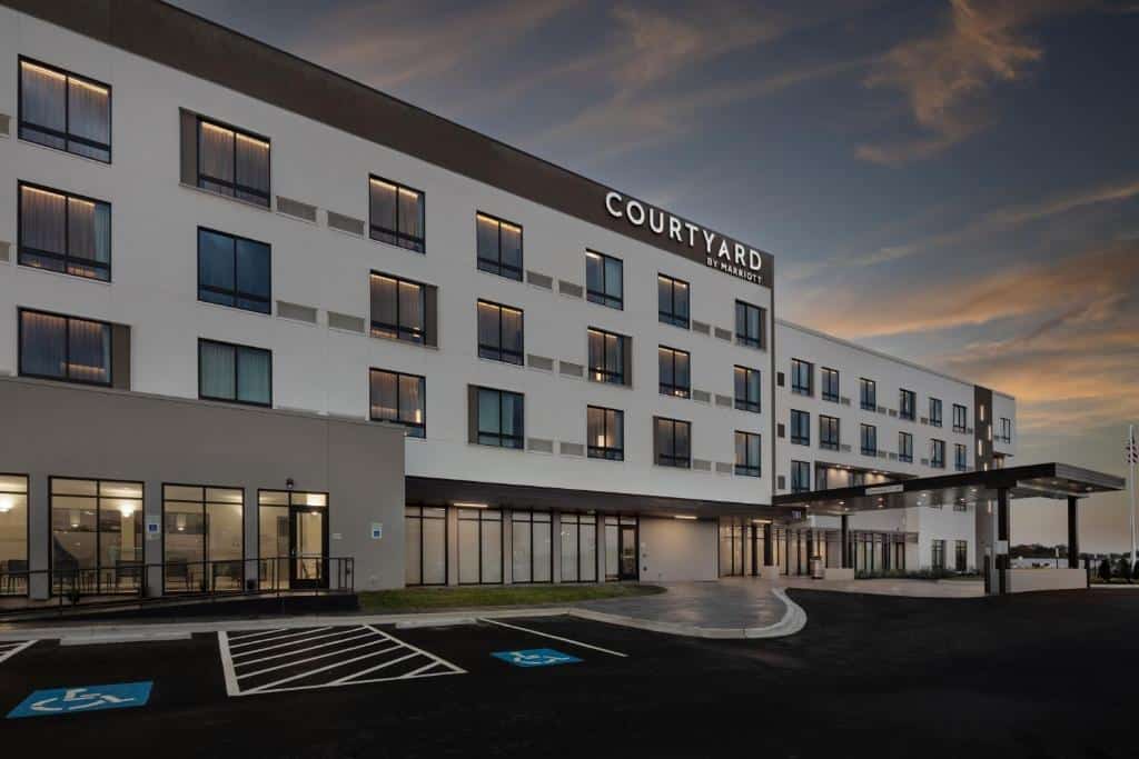 The Courtyard by Marriott in Conway, Arkansas. A large rectangular building that is brown and beige.
